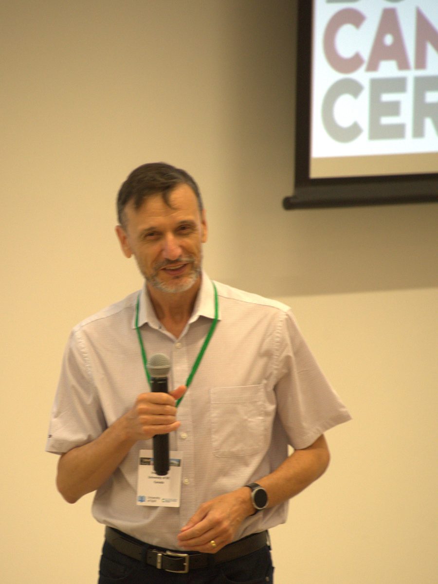 Dr. Inan&ccedil; Birol holding a microphone and smiling during his IMAP 2026 talk
